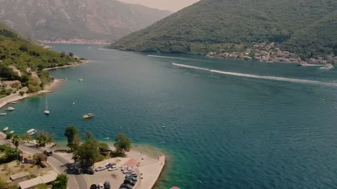 View of a winding mountain road along the coast, cozy houses, beaches, sea Stock Footage 202240901