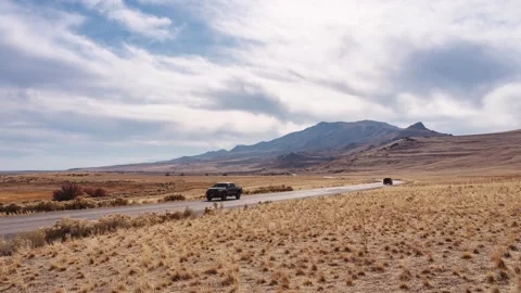 View of a winding road through an arid landscape in the United States. Video stock 344409896