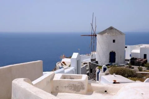 View of the windmill and the sea Stock Photos