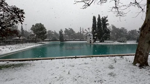 View of windmill in the centre of a lake in Greece. Stock Footage 169164055