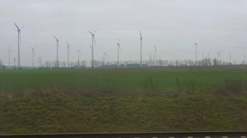 View of windmills from a train Stock Footage 127423447