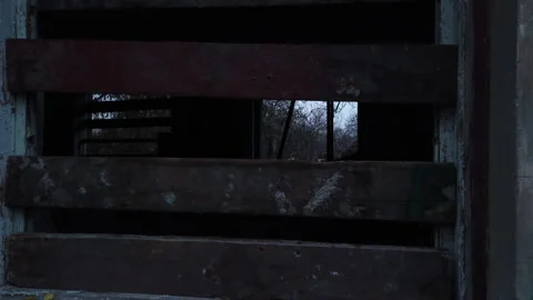 View on a window of abandoned building with graffiti on the walls. Slow motion m Video stock 145473048