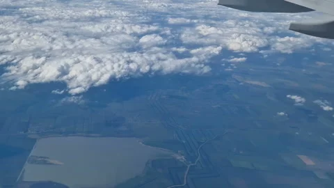 The view from the window of an air plane to the clouds, blue sunny sky. Stock Footage 274891903