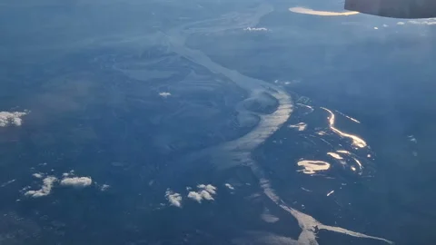The view from the window of an air plane of clouds and blue sunny sky. Stock Footage 277809156