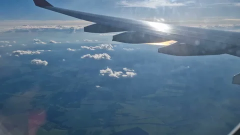 The view from the window of an air plane to the clouds, blue sunny sky. Stock Footage 278280730