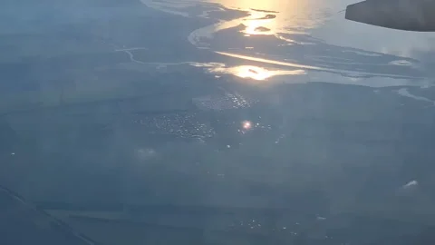 The view from the window of an air plane to the clouds, blue sunny sky. Stock Footage 278280958