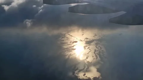 The view from the window of an air plane to the clouds, blue sunny sky. Stock Footage 278281481