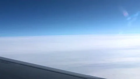 View from the window of the aircraft. Beautiful view of the clouds through the Stock Footage 203815407