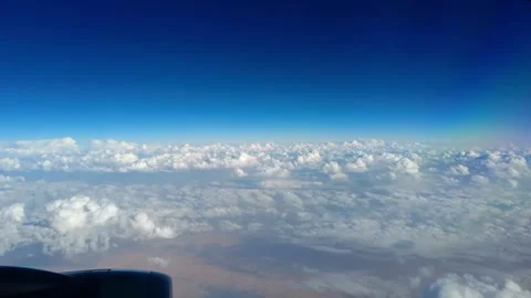 A view from the window of the aircraft flying over clouds Stock Footage 313685859