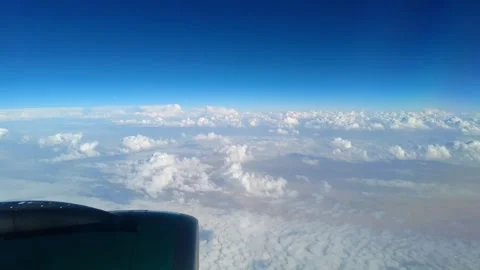 A view from the window of the aircraft flying over clouds Stock Footage 313685869