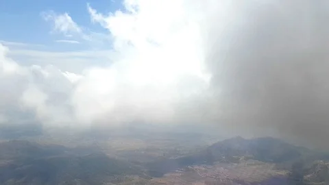 View from the window of the aircraft when it comes to landing through the clouds Stock Footage 101778682