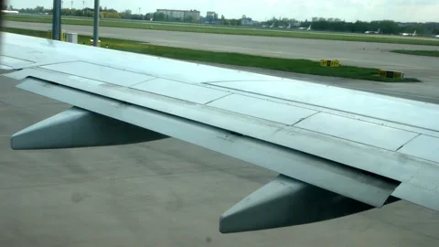View from the window of the aircraft on the wing of the aircraft during takeoff. Stock Footage 200478352