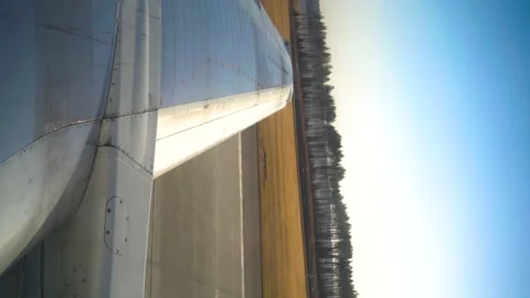 View from window of the aircraft on the wing and runway during plane landing. Video stock 240188745