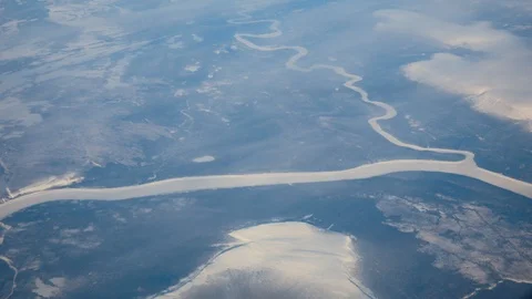 View From The Window Of The Aircraft On Winter Landscape With Ice-Covered River Stock Footage 92665046