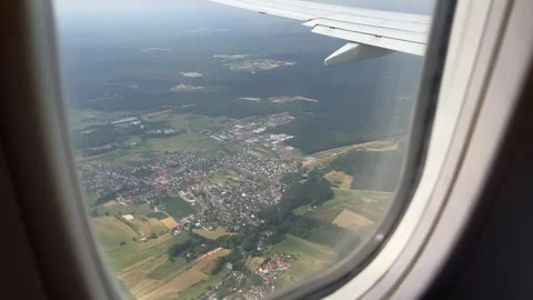 View from window of airplane approaching Nuremberg, Bavaria, Germany in summer Stock Footage 246355828