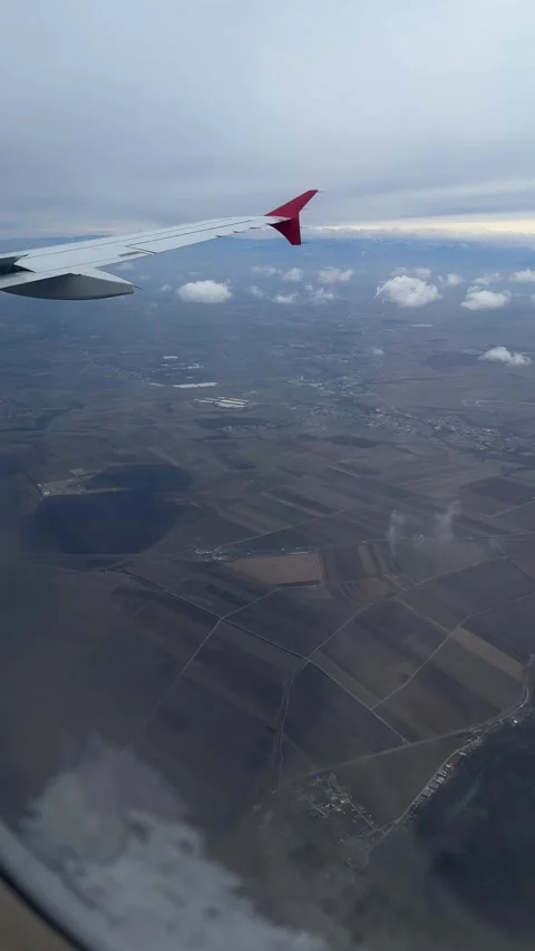 View from window of airplane approaching Vienna in winter. Vertical Stock Footage 262365098