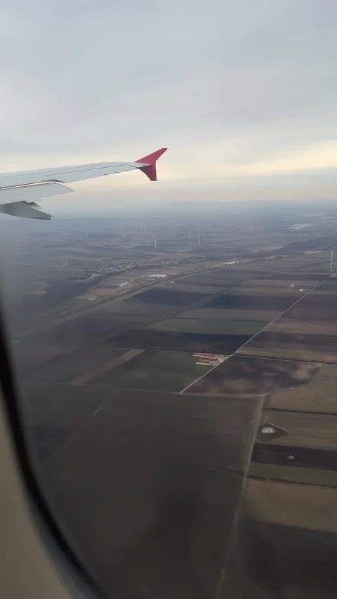 View from window of airplane approaching Vienna in winter. Vertical Stock Footage 262365167