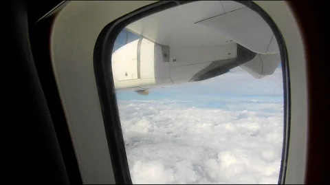 View from the window of an airplane.  Flying above the clouds. Stock Footage 122834629