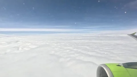 View from the window of the airplane. Flying above the clouds. Stock Footage 300174442