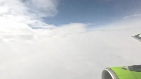 View from the window of the airplane. Flying above the clouds. Stock Footage 300176506