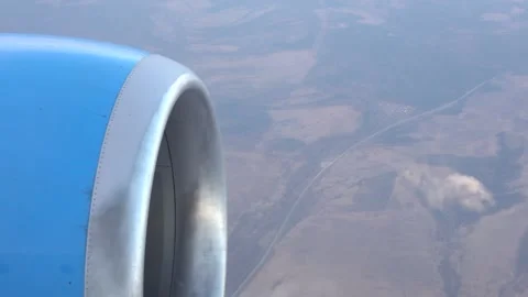 View from the window of an airplane flying over the countryside. In the foreg Stock-Footage 170877217