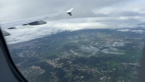 View from window of airplane flying over Portugal and approaching Lisbon Stock Footage 227132153