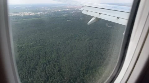 View from window of airplane landind in Nuremberg, Germany in summer Stock Footage 246355840