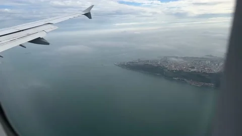 View from window of airplane landing in Lisbon in December Stock Footage 226991131
