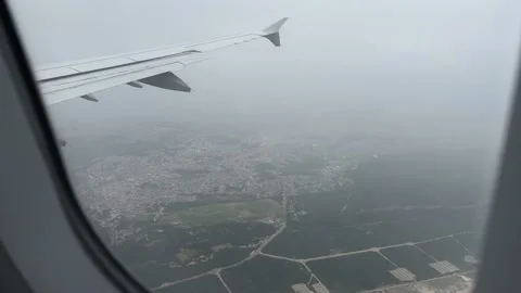 View from window of airplane landing in Lisbon in December Stock Footage 226991567