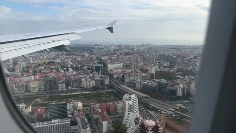 View from window of airplane landing in Lisbon in December Stock Footage 226991678