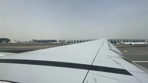 View from the window airplane taking off at Dubai international Airport Stock Footage 154613725