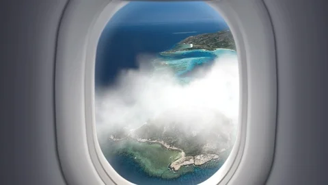 View from the window in airplane to tropical islands Stock Footage