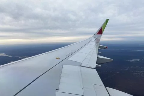 View from the window of an airplane on the wing of the plane Stock Photos