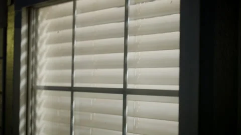 View of the window with blinds. Blinking light reflecting on the glass. Close up Stock-Footage 311690575