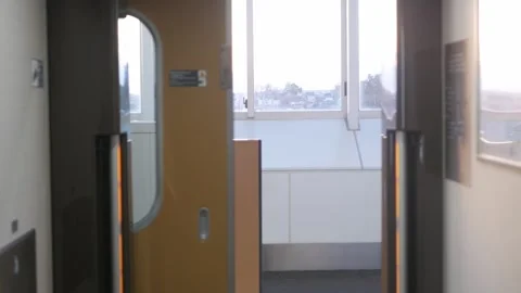 View to window on board at bullet high speed train's door with view outside.. Vídeos de archivo 337008259