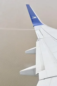 View from a window of a Boeing 737-700 jet which has just taken off Stock Photos