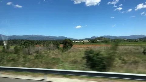 View from window of bus going through Catalonia to France. Slow mo Stock Footage 107917268