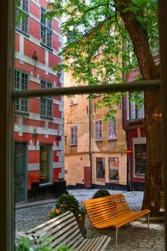 View from the window of cafe on a small courtyard Stock Photos