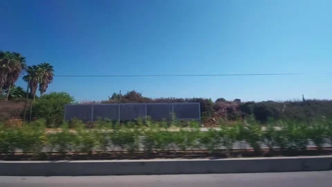 View from the window of a car in motion on the nature of Turkey, buildings and Stock Footage 304111242