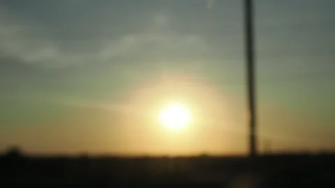View from the window of a car moving along the road at sunset 스톡 동영상 286026044