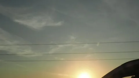 View from the window of a car moving along the road at sunset 스톡 동영상 286026276