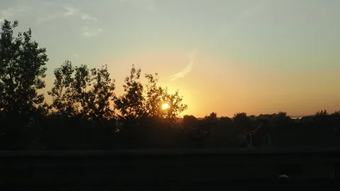 View from the window of a car moving along the road at sunset 스톡 동영상 286026279