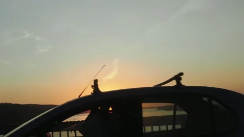 View from the window of a car moving along the road at sunset 스톡 동영상 286026613