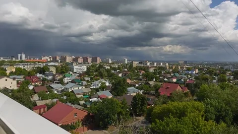 View from the window of the city and clouds in the sky. Timelapse 動画素材 194357053