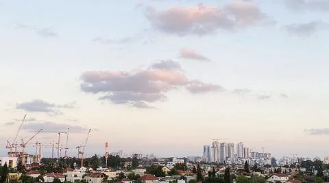 View from the window. The city at sunset 库存照片