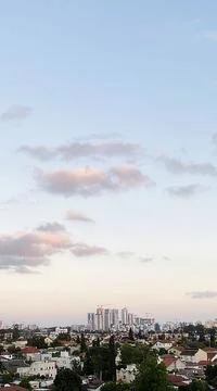 View from the window. The city at sunset 库存照片