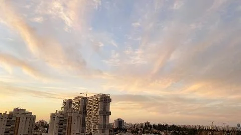 View from the window. The city at sunset 库存照片