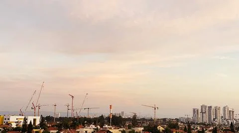 View from the window. The city at sunset 库存照片