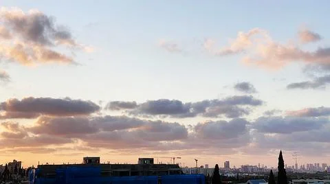 View from the window. The city at sunset 库存照片