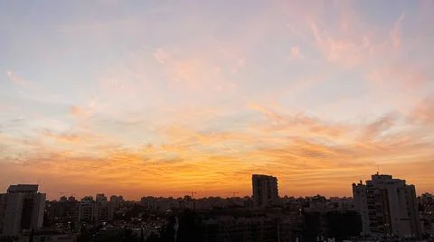 View from the window. The city at sunset 库存照片